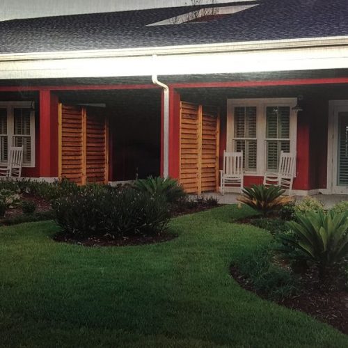 custom wood fencing used as stylistic décor for front porch